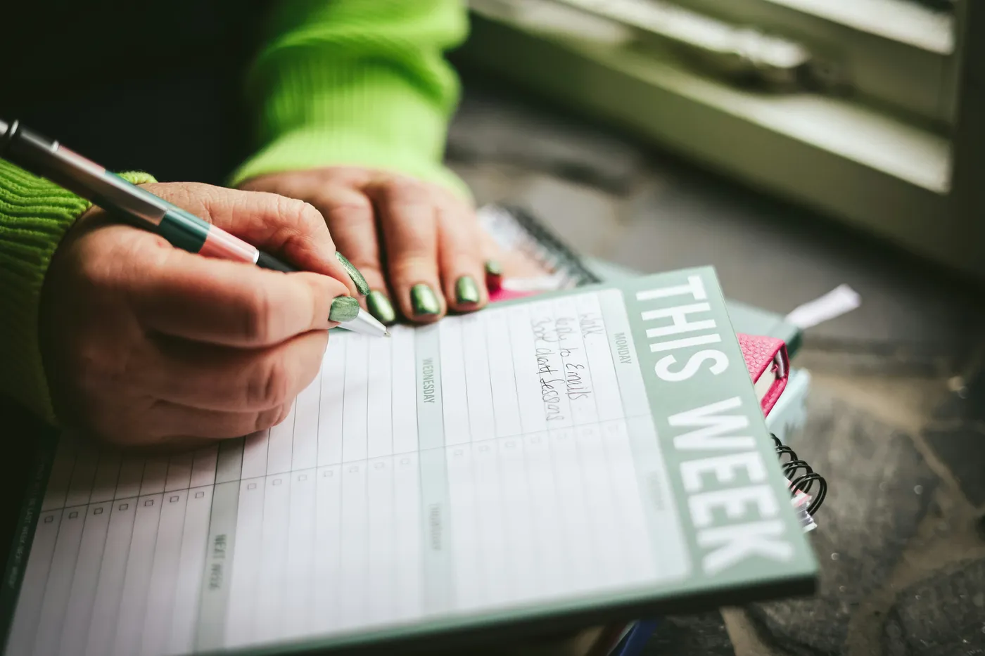 A person scheduling an appointment in their diary.